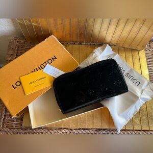L.V. NWB black patent leather zippered wallet.
